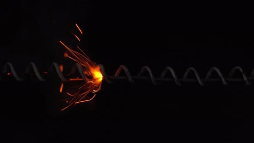 Burning Fuse Emitting Bright Sparks in Dark