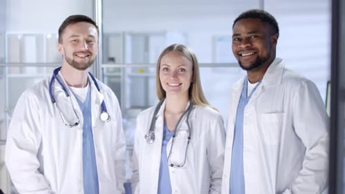 Smiling Medical Professionals Posing in Hospital Office