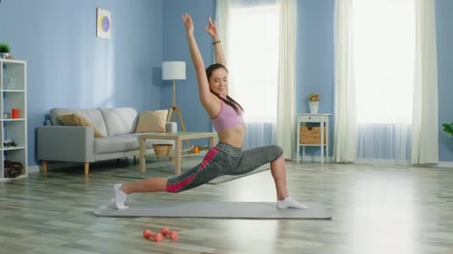 Young Woman Does Yoga at Home