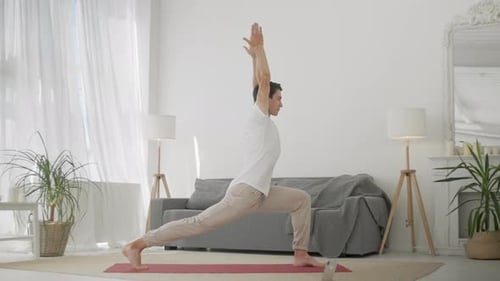 Young Adult Doing Yoga Pose at Home
