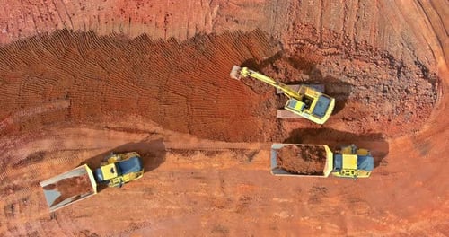 Top Aerial View Excavator Truck are Loading Soil a Dump Truck