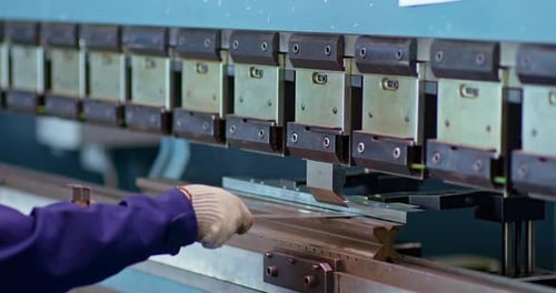 Close-up, Cnc Bending of Metal, Factory Professional Installation for Bending Metal. Worker Inserts