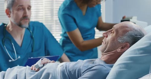 Doctor Visiting Patient in Hospital