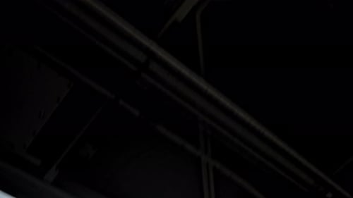 Under Bridge With Skyscraper Against Cloudy Sky New York