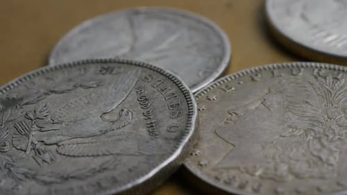 Rotating stock footage shot of antique American coins - MONEY 0090