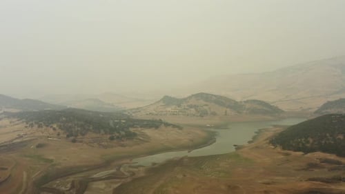 Descending drone aerial of a lake bed drying up during drought conditions. Emigrant Lake in Southern