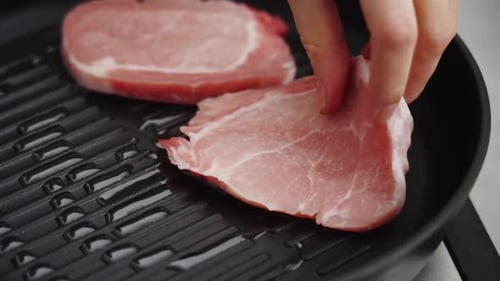 Hands Place Raw Meat Into Cooking Pan