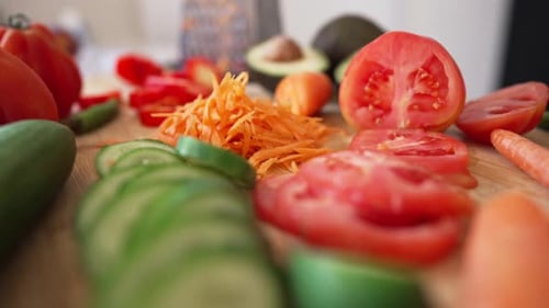 Fresh Vegetables and Fruits Arranged on a Cutting Board