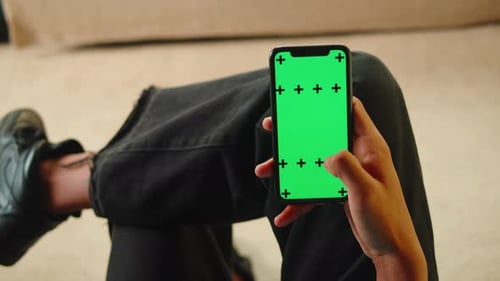 African American Man Using Smartphone with Chroma Key Closeup