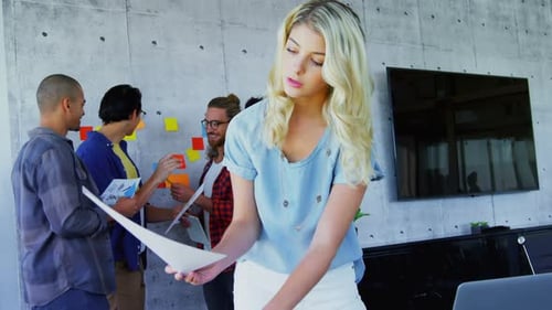 Young Adults Collaborate in Modern Urban Office