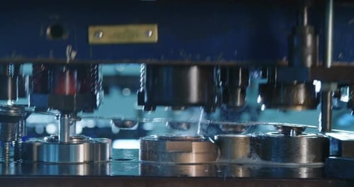 Close up shot of a punch press forming metal parts