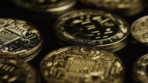 Rotating shot of Bitcoins (digital cryptocurrency) - BITCOIN 0522