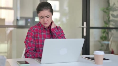 Young Woman Has Neck Pain Using Laptop