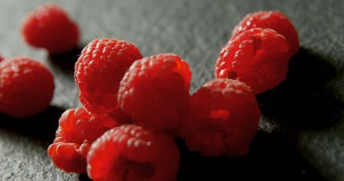 Raspberries on black background 4K 4k