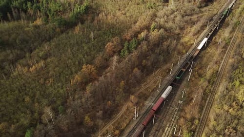 Aerial View of Freight Train Riding in Countryside