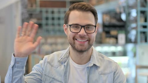 Young Man Waving Welcoming