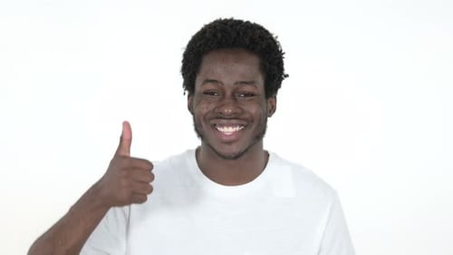 Smiling Young Adult Gives Thumbs Up Approval
