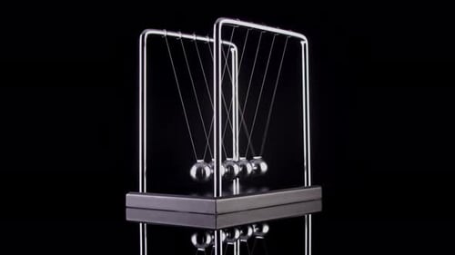 Newton's Cradle Swinging in Perpetual Motion