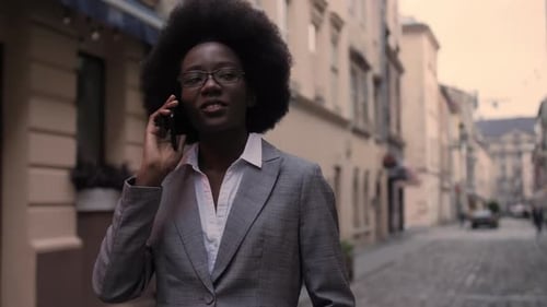 Business Woman Talking on Smartphone in City