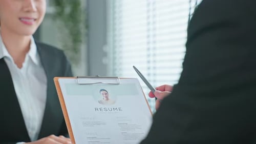 Close up of woman give resume to hr manager for job interview in office.