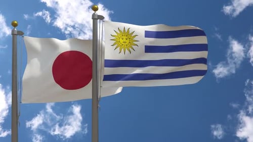 Bandera de Japón vs bandera de Uruguay en asta de bandera