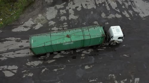 The Car Wagon Truck Bringing a Container for Unloading in the Warehouse