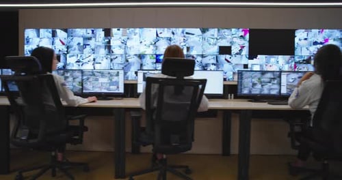 Team Monitors Security Cameras in Control Center