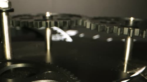 Close Up Black Gears Turning Slowly