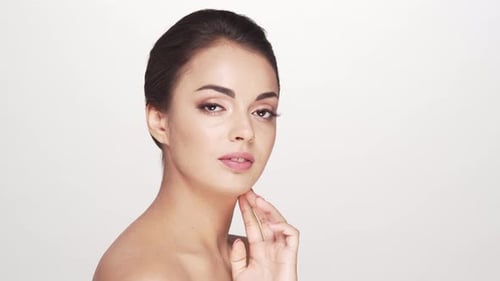 Studio portrait of young and beautiful brunette woman over