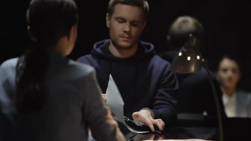 Man in Handcuffs Rips Up Document