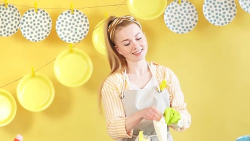 Hardworking Positive Housewife Putting on Gloves