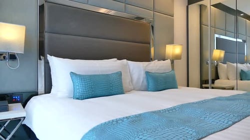 Modern Bedroom Interior with Large Bed and Mirror