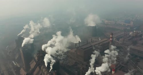 Top View of the Metallurgical Plant. Smoke Coming Out of Factory Pipes. Ecology