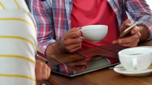 Men Meeting with Tablet and Smartphone