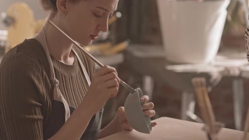 Young Woman Working with Ceramics at Workshop