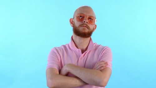 Bald Man with Beard and Sunglasses Poses