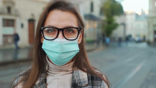 Adult Wearing Surgical Mask in Urban Setting