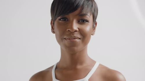 Mixed Race Black Woman in Studio Watching To the Camera and Smiling