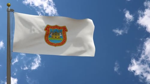 White Flag with Coat of Arms Waving Against Blue Sky