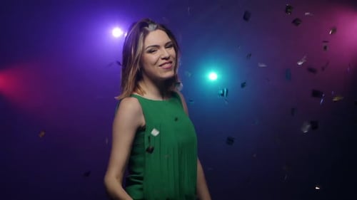 Dancing of Young Woman in Green Dress. Close-up