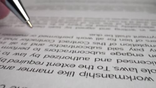 Businessman sign signature on document contract paper at office desk