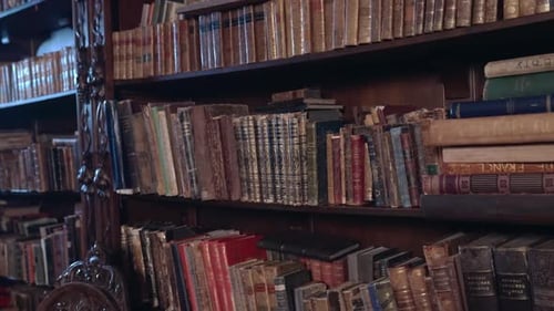 old library with shelves of antique books.