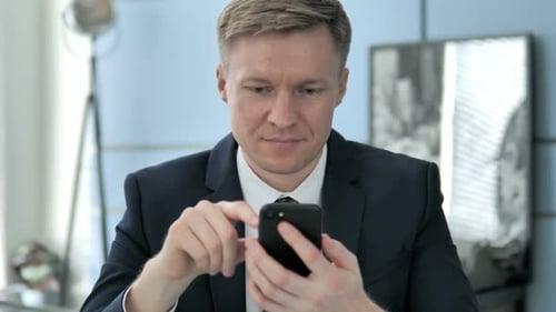 Adult Using Mobile Phone in Workplace