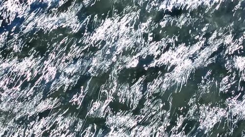 Glistening Sunlight Reflecting on Rippling Ocean Surface