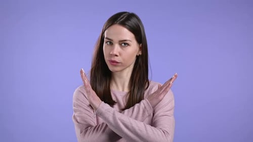 Pretty Girl Disapproving with No Crossing Hands Sign Make Basta Negation Enough Gesture