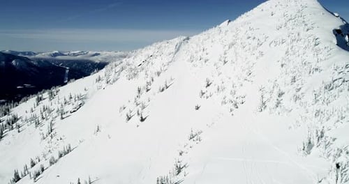 Snow capped mountain during winter 4k