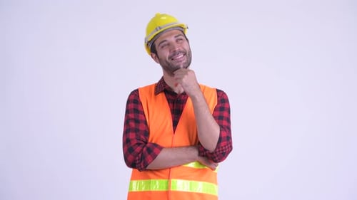 Thoughtful Man Wearing Hard Hat and Safety Vest