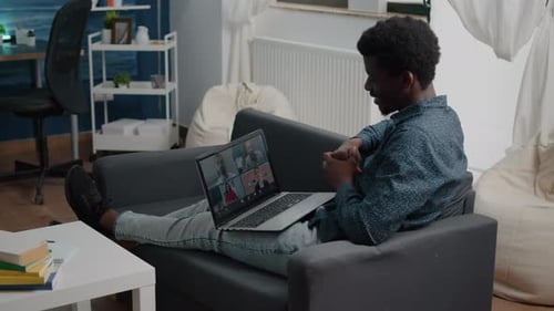 Adult on Laptop Video Call from Home