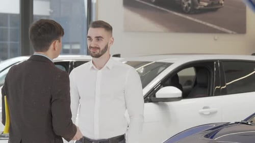 Car Salesman Giving Car Keys to Customer