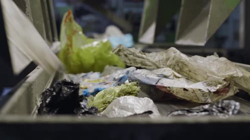 Waste Plastics Move Along Recycling Plant Conveyor Belt